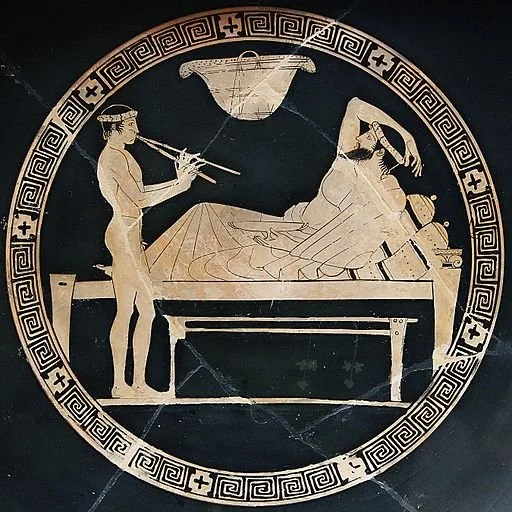 Ancient Greek pottery depicting musicians with reed instruments