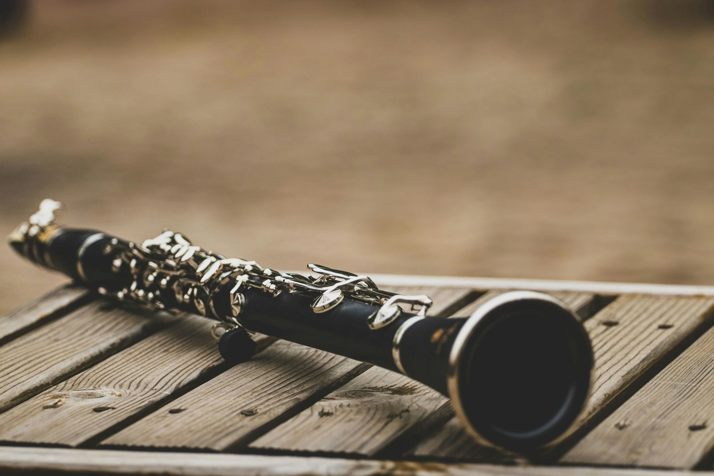 Clarinet resting on a wooden surface